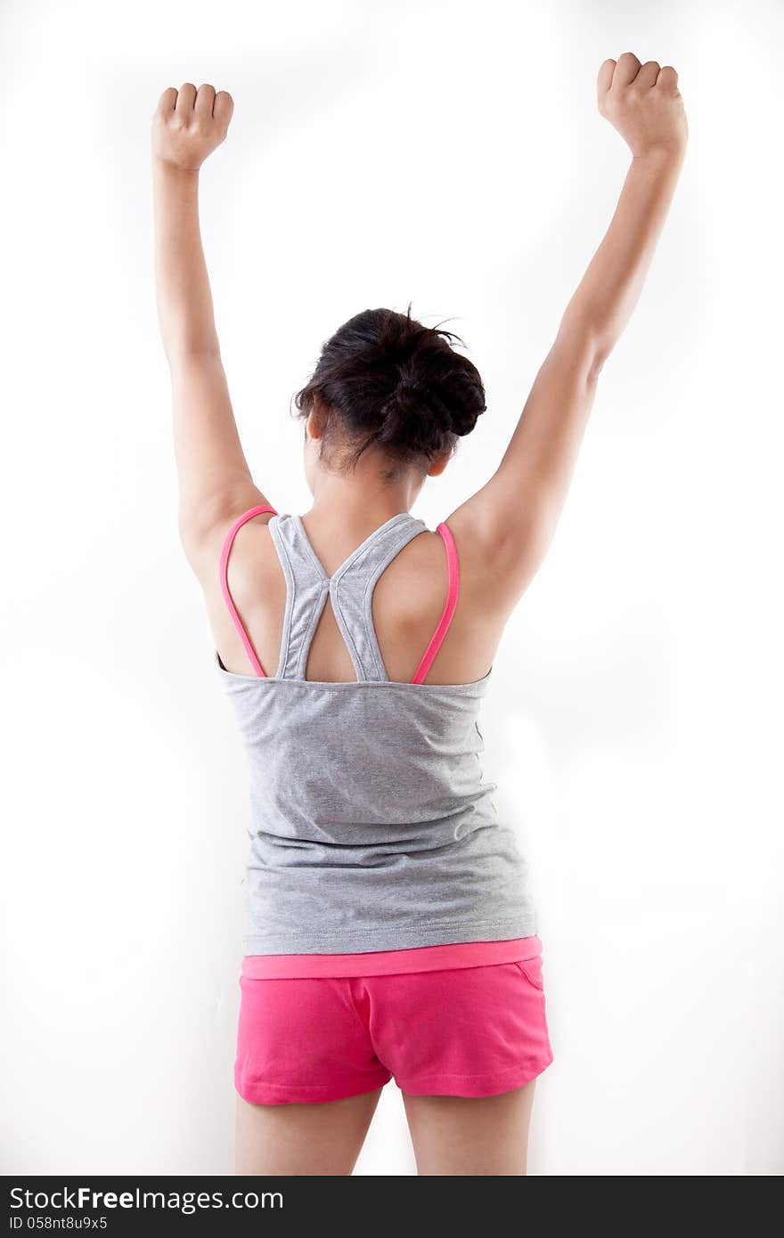 Back view of a indian modern girl raising up her arms against white. Back view of a indian modern girl raising up her arms against white