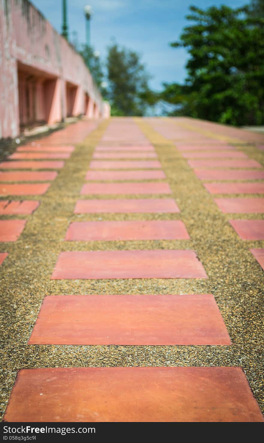 Empty sidewalk on a bridge with blue sky