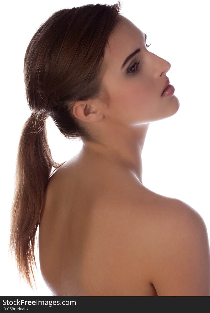 A portrait of a pretty teen with a bare back. A portrait of a pretty teen with a bare back