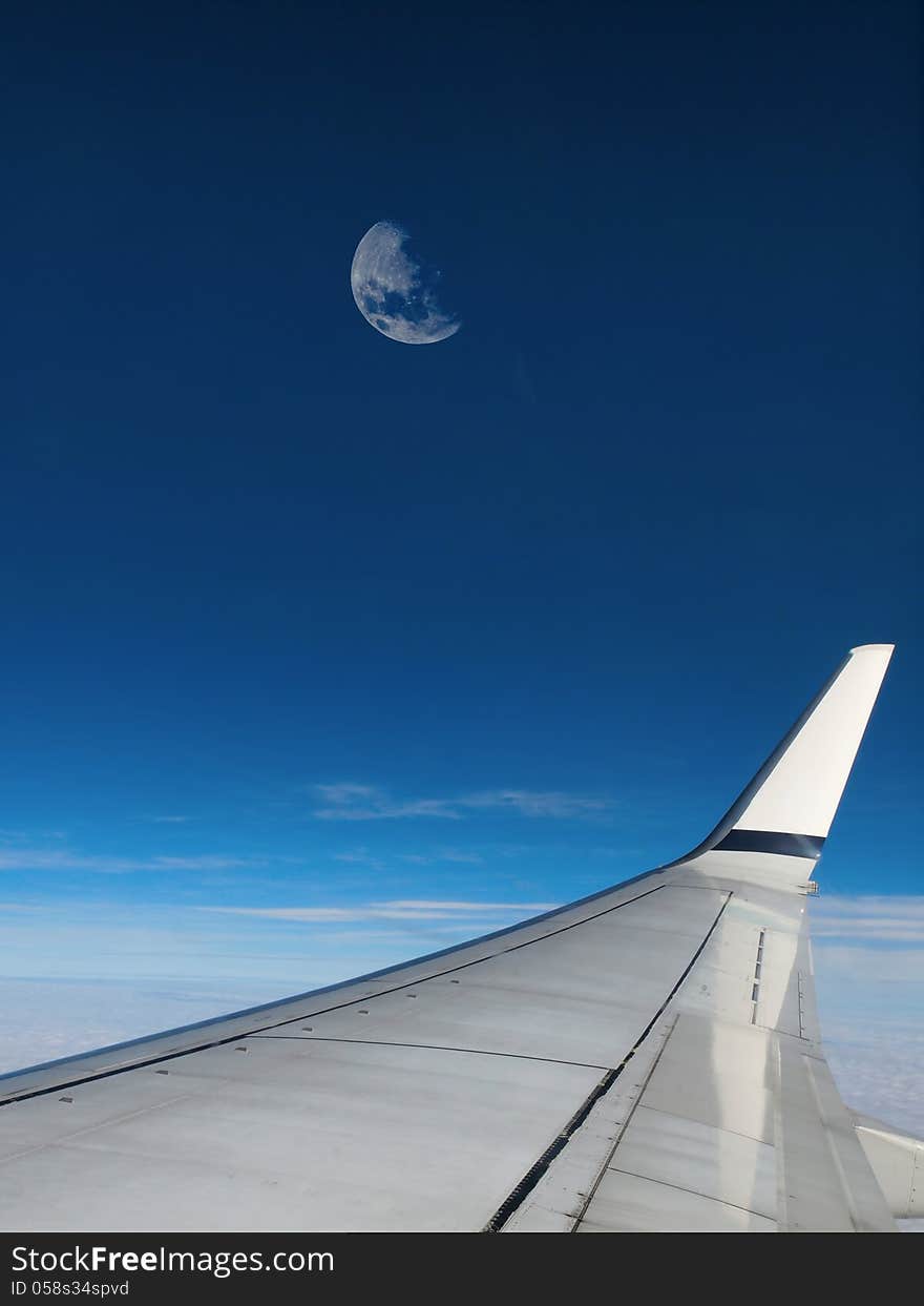 Moon in airplane window