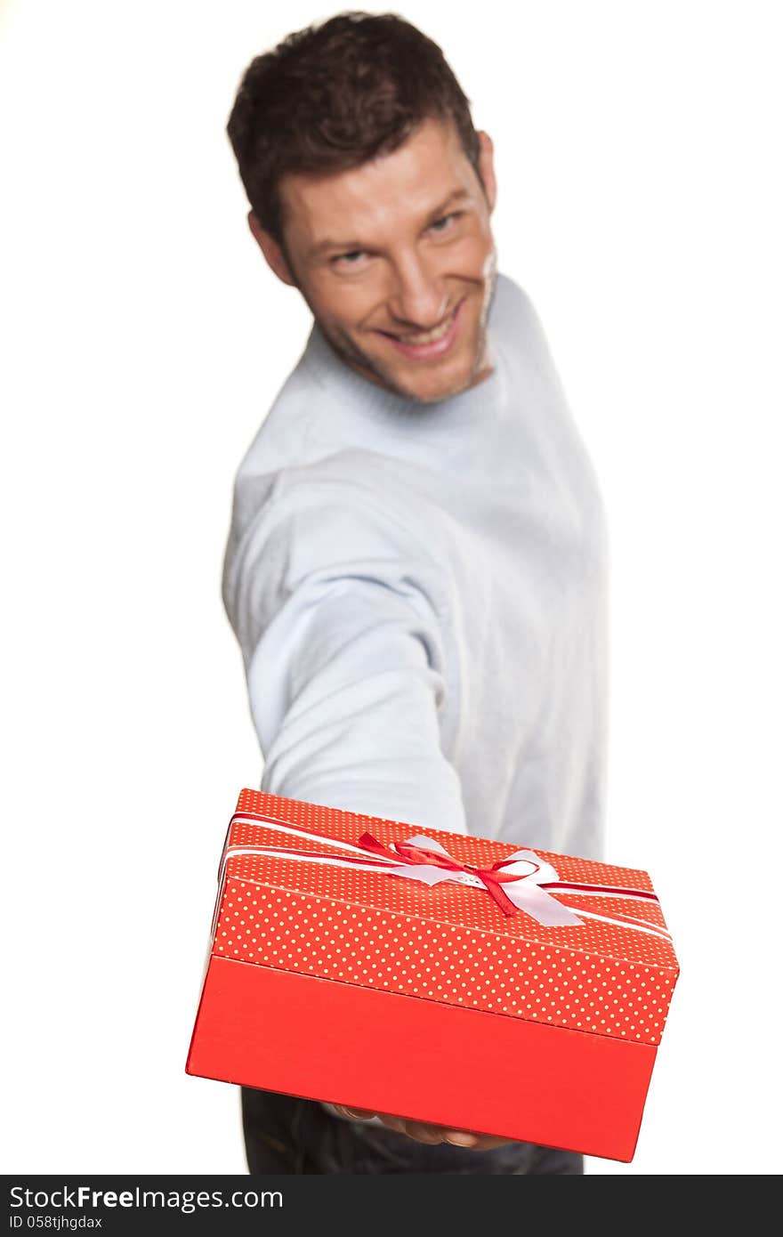 Handsome Man Offering A Present On White Background. Handsome Man Offering A Present On White Background