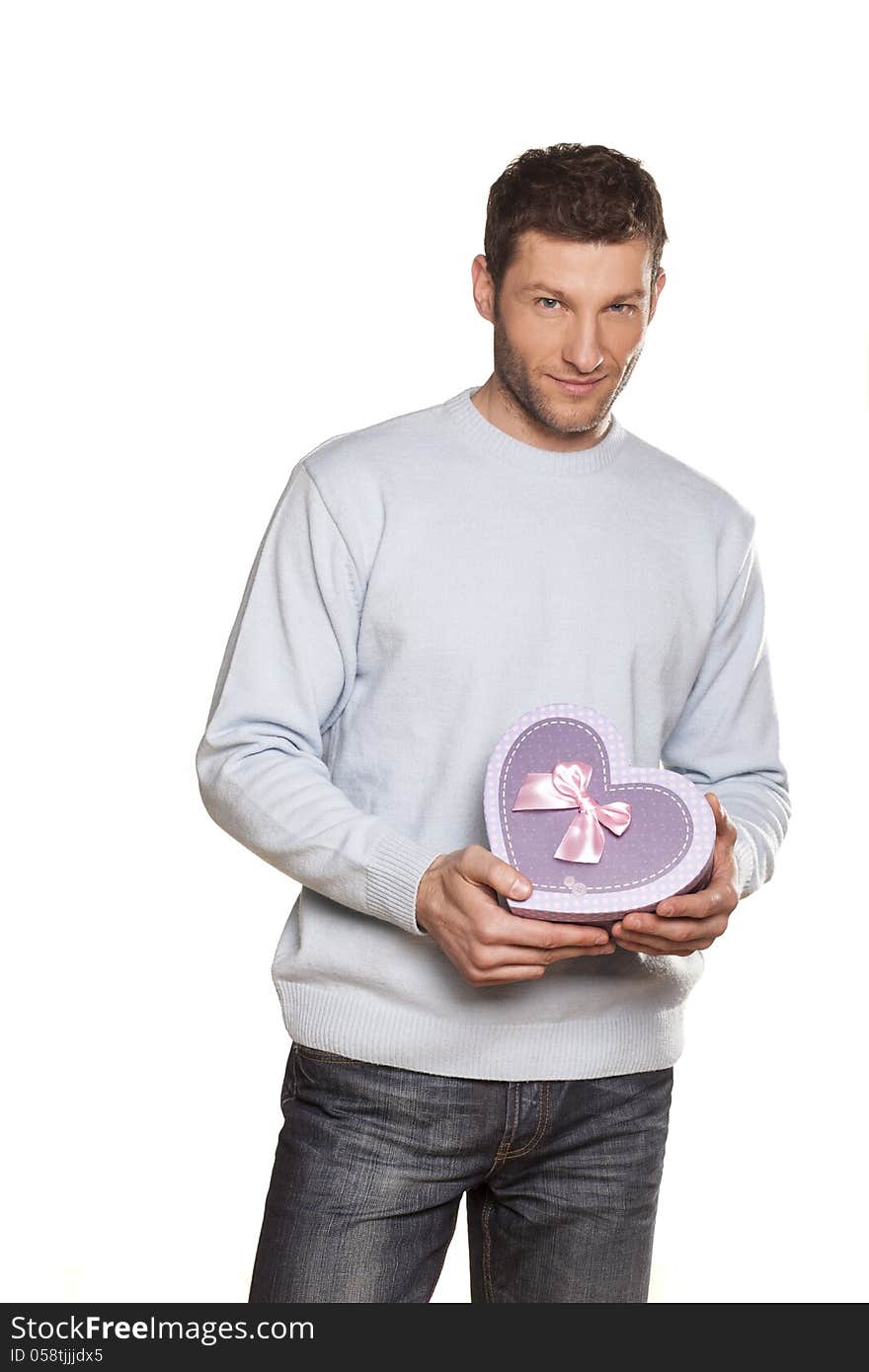 Handsome Man Offering A Present On White Background. Handsome Man Offering A Present On White Background