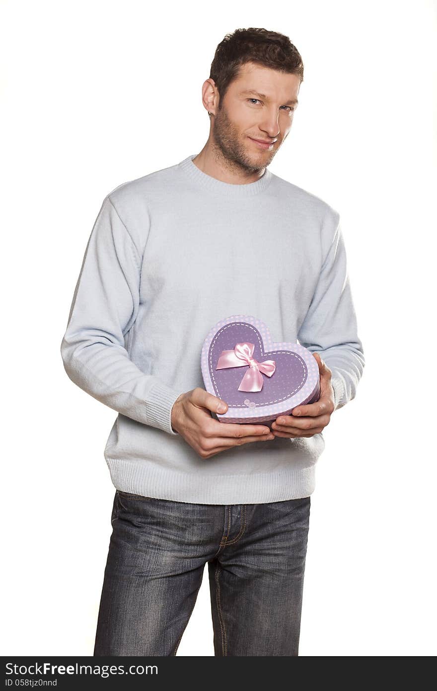 Handsome Man Offering A Present On White Background. Handsome Man Offering A Present On White Background