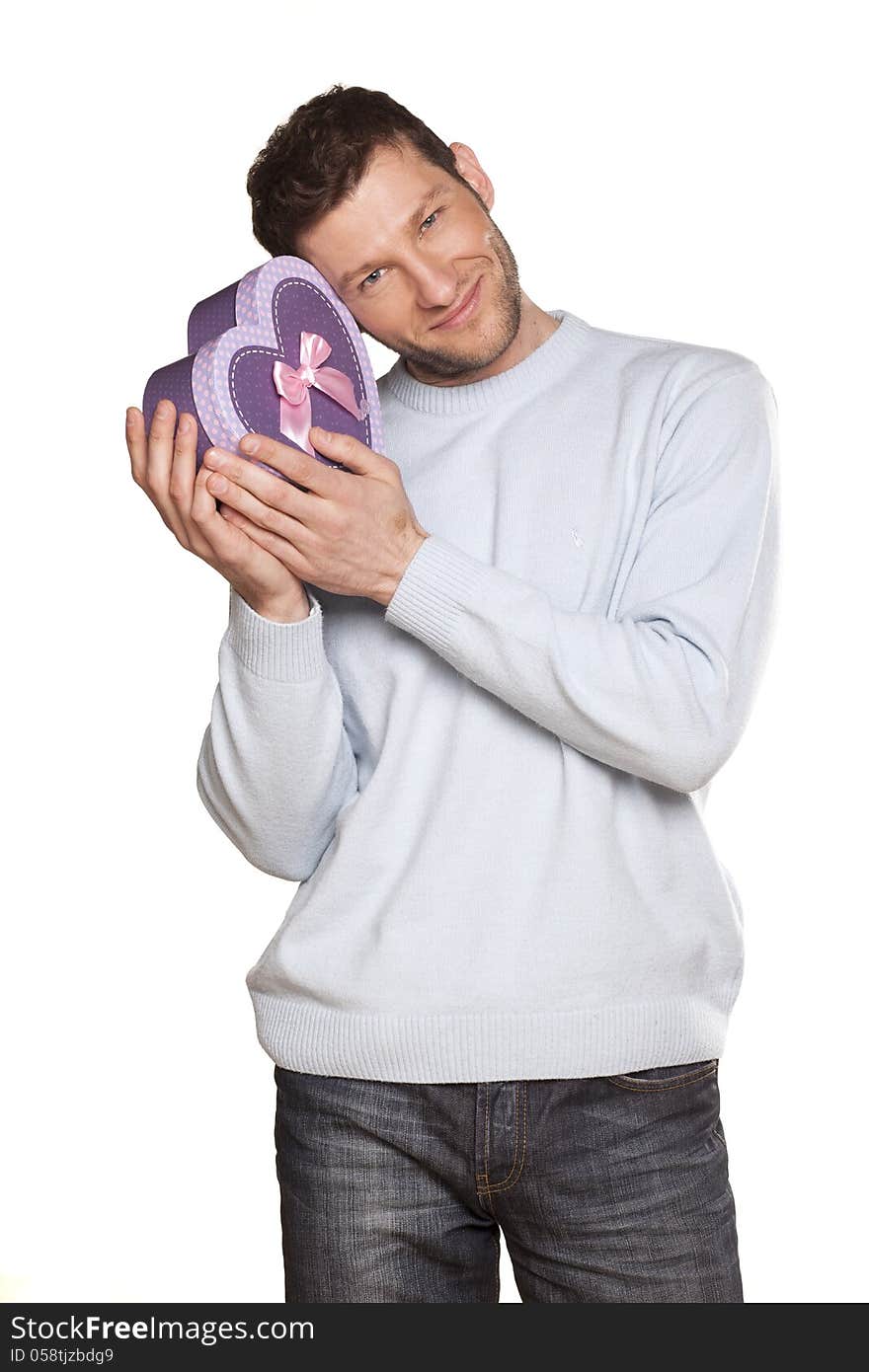 Handsome Man Offering A Present On White Background. Handsome Man Offering A Present On White Background