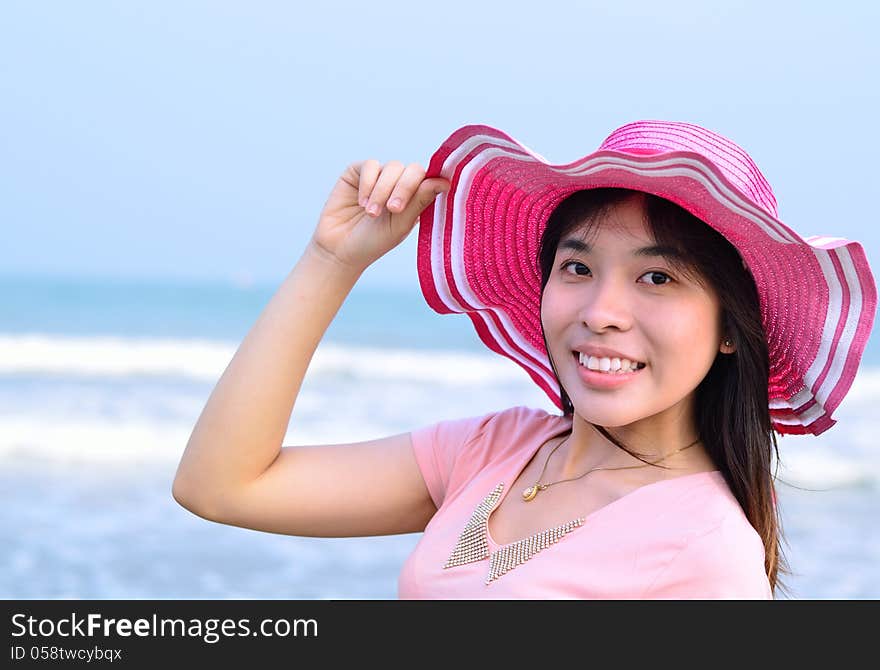 Beautiful Asian Woman Relaxation On Beach With Hat