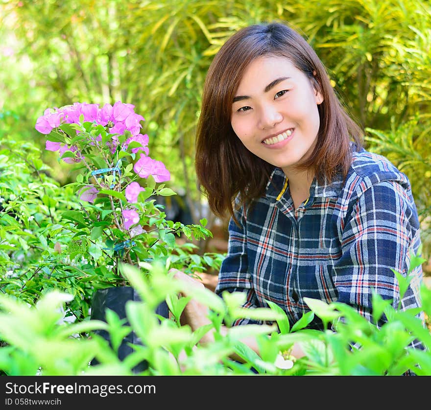 Beautiful Asian Women In Flowers Garden