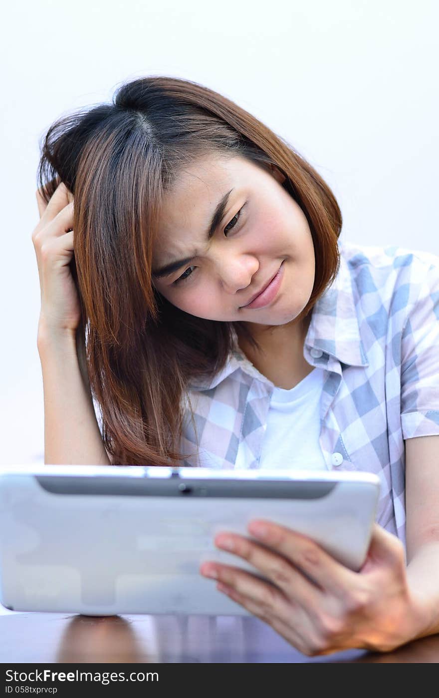 Beautiful young student have question on the tablet screen