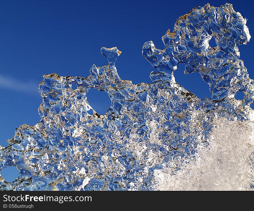 A piece of ice on sky background