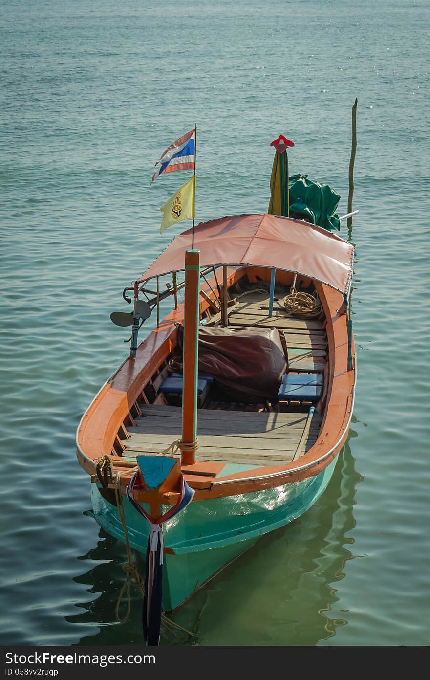 A green long tail boat at panwa cape, phuket