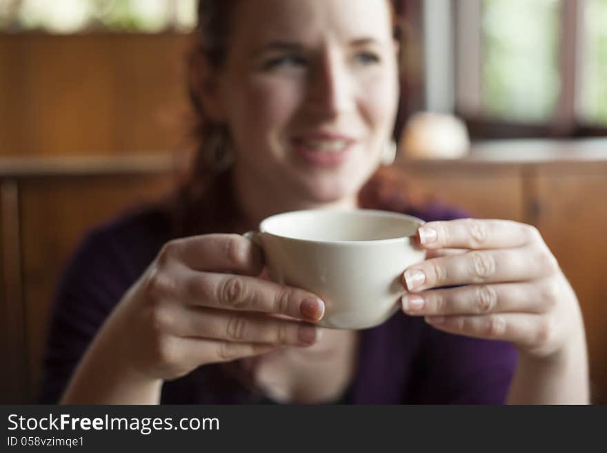 Woman Holding Her Morning Cup of Coffee