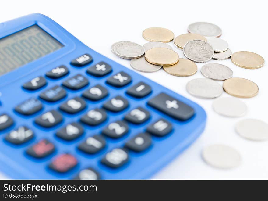 calculator and thai coins on white background.