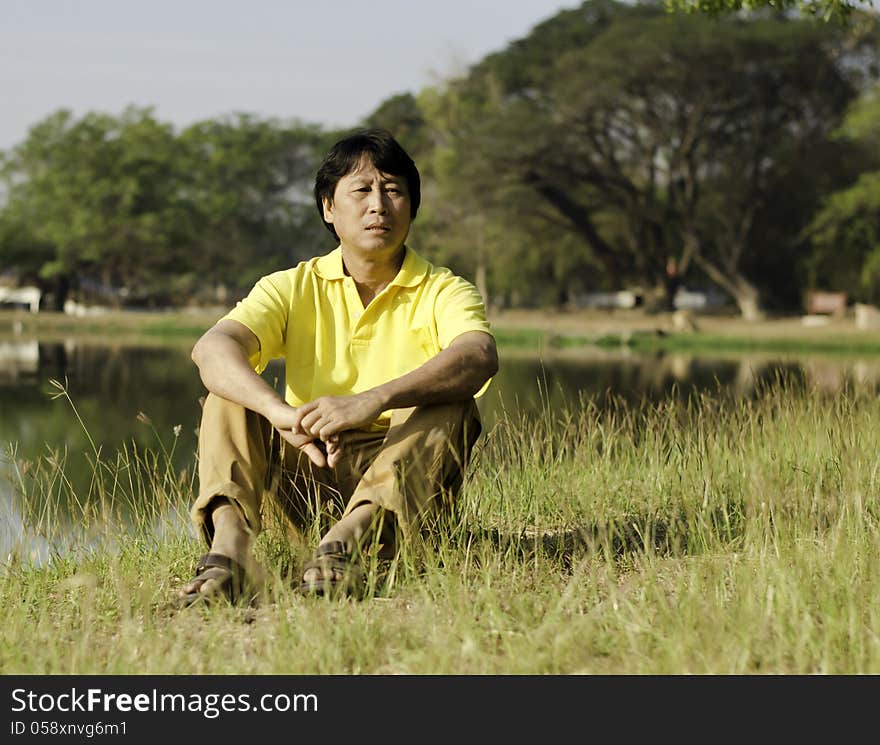 Serious man in a summer park. Serious man in a summer park