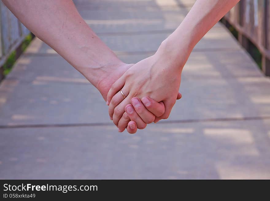 Hands of the bride and the groom with wedding rings