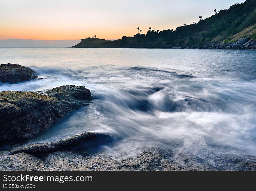 Sea wave on the rock at sunset time at promthep cape phuket. Sea wave on the rock at sunset time at promthep cape phuket