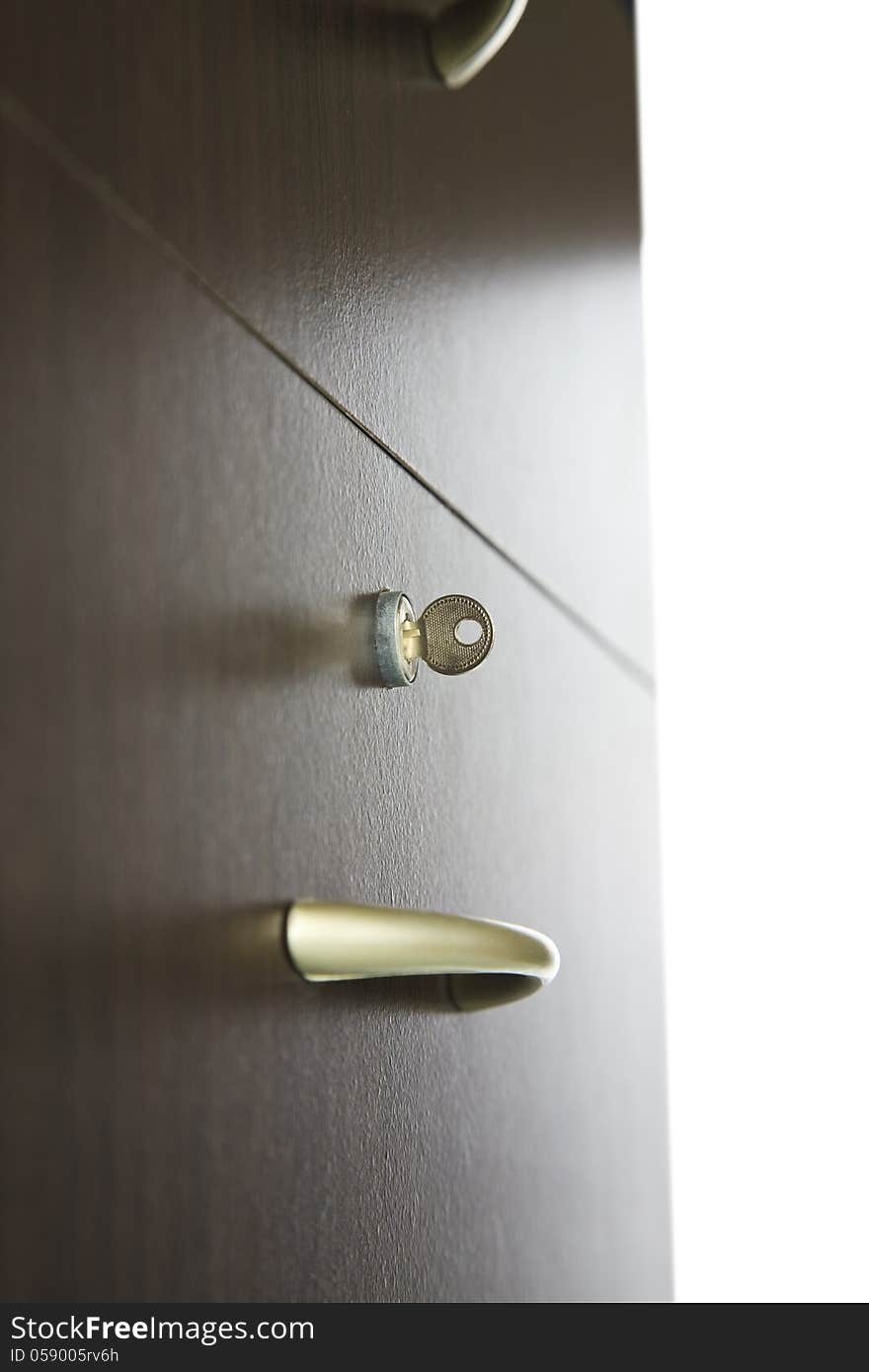 Close-up of a drawer with keys in lock