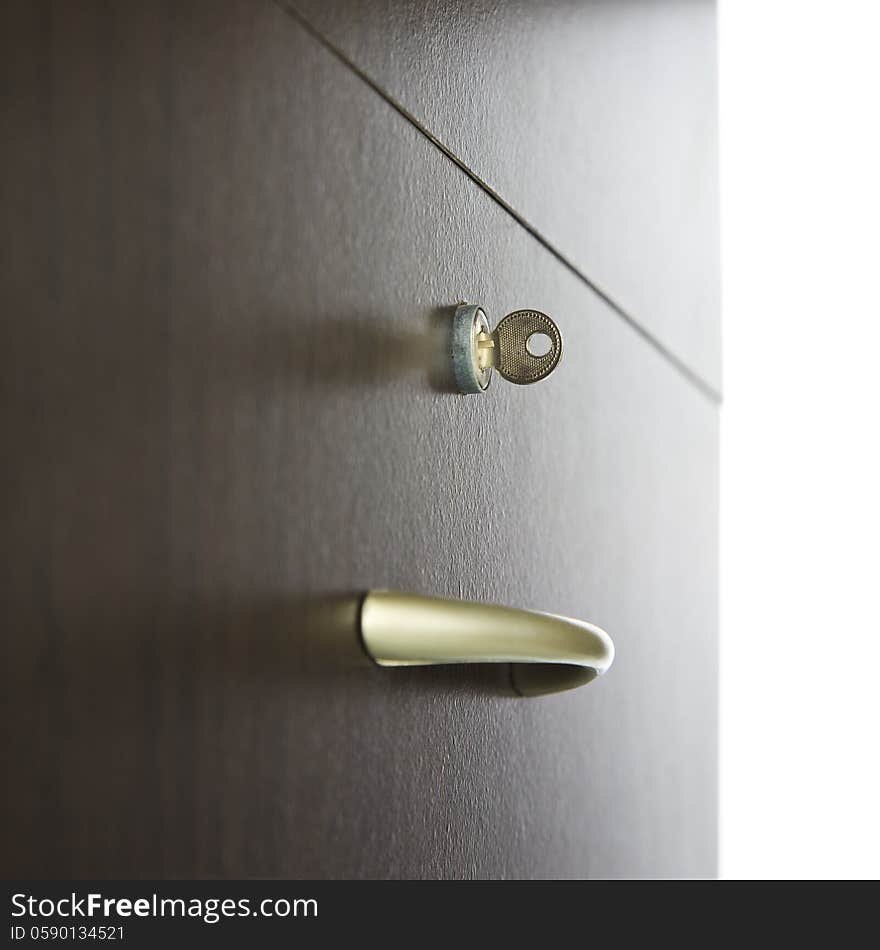 Close-up of a drawer with keys in lock