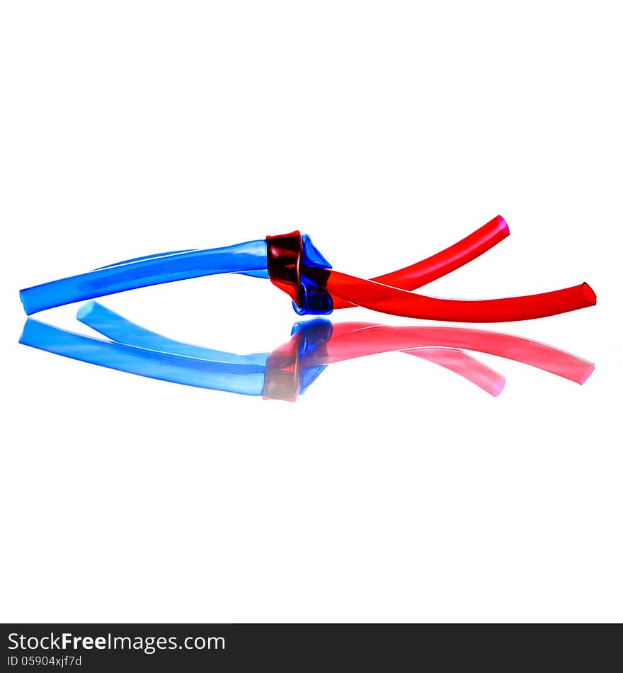 Two red and blue PVC Hoses tied