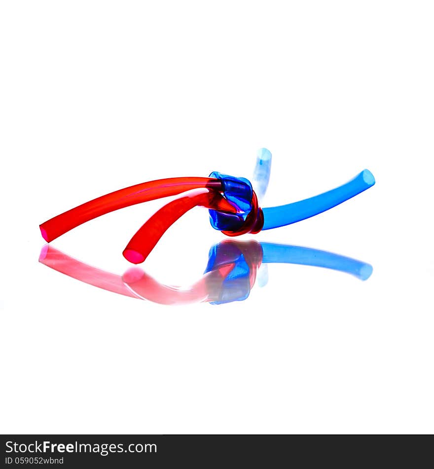 Two red and blue PVC Hoses tied