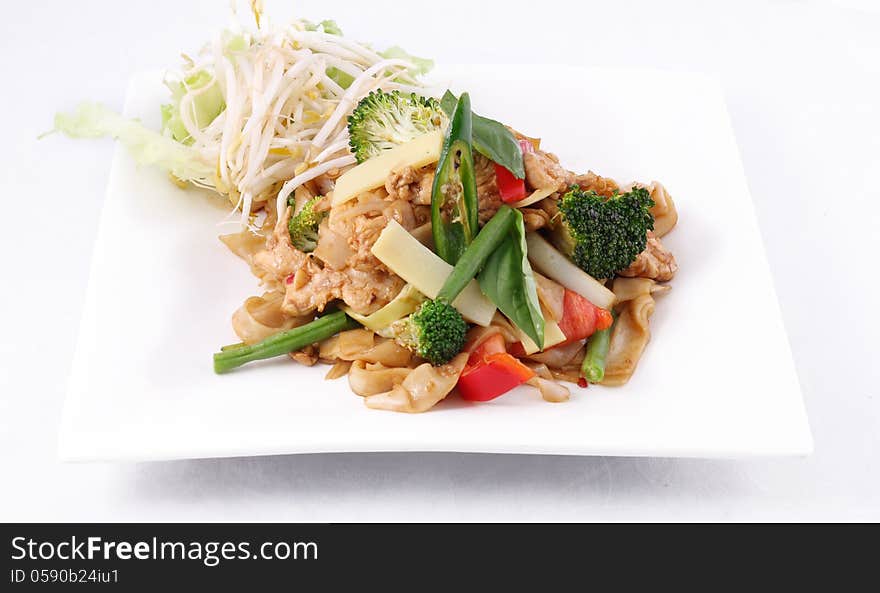 Flat rice noodle stir fried with Thai herb  and basil.