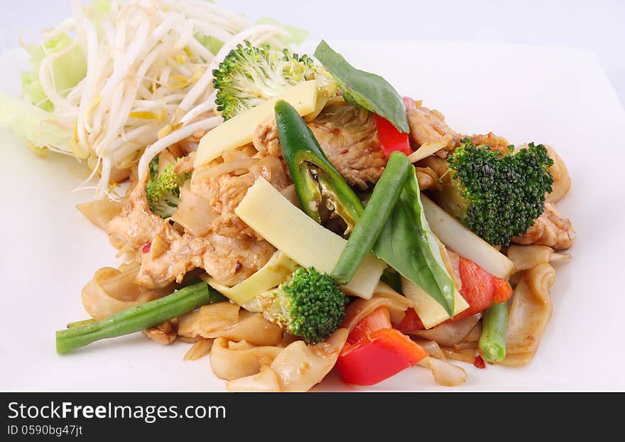 Flat rice noodle stir fried with Thai herb  and basil.