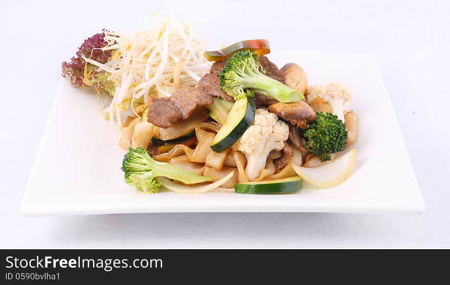 Flat rice noodle stir fried with oyster sauce and fresh vegetabl