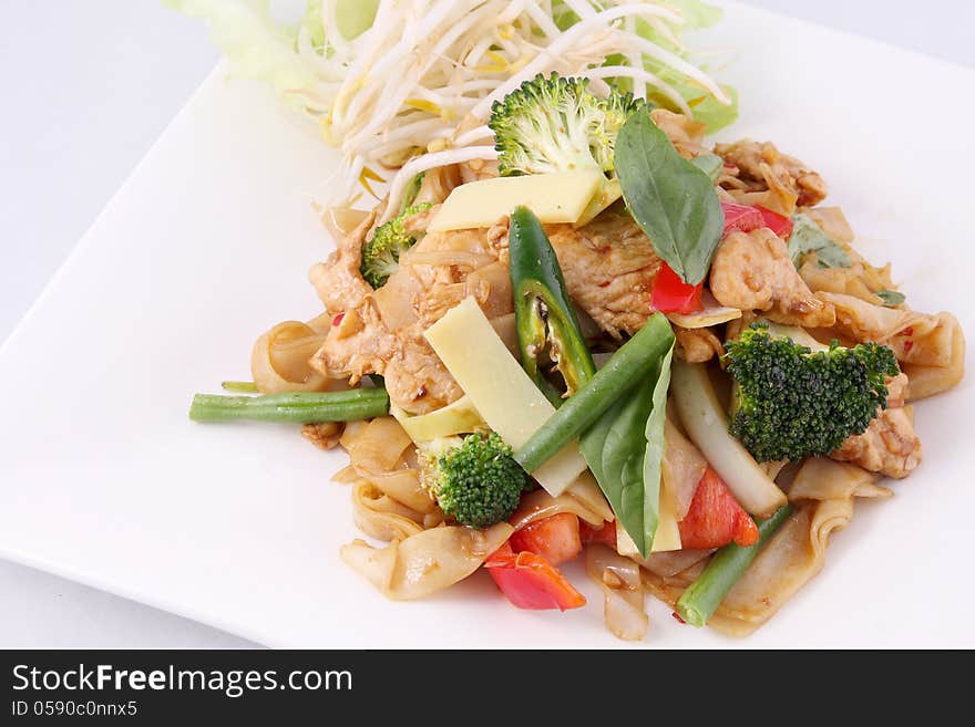 Flat rice noodle stir fried with Thai herb  and basil.