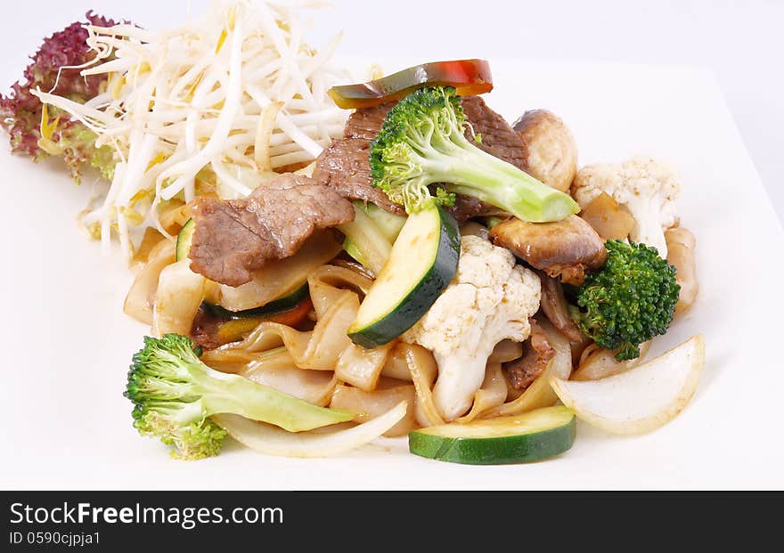 Flat rice noodle stir fried with oyster sauce and fresh vegetabl