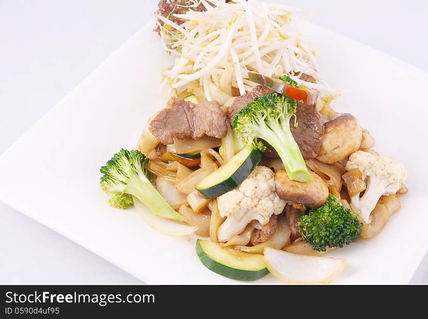 Flat rice noodle stir fried with oyster sauce and fresh vegetable