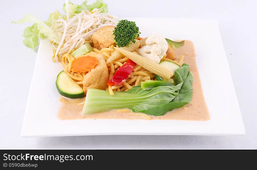 Hokkien noodles with red curry sauce and fresh vegetables