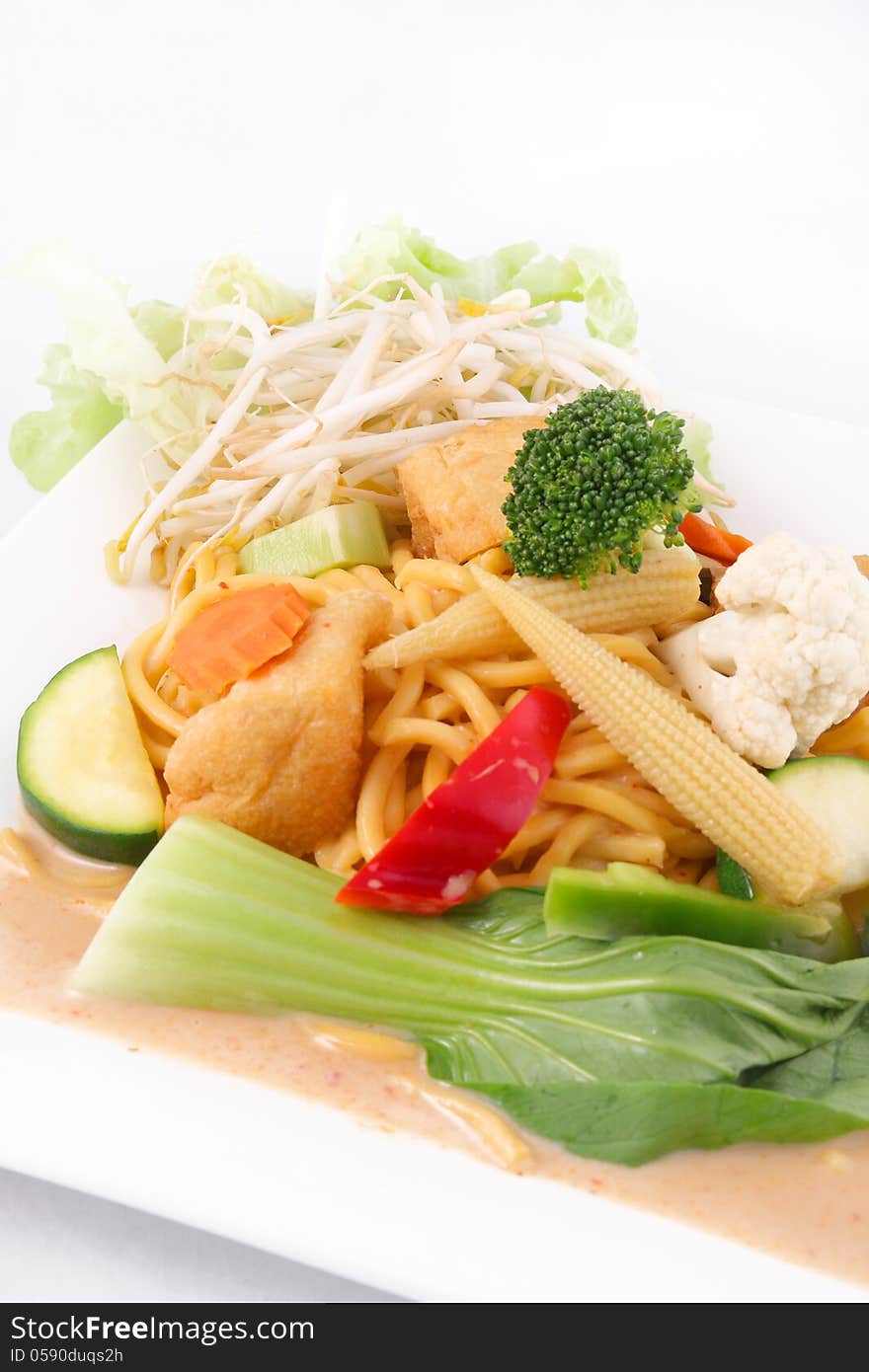 Hokkien Noodles With Red Curry Sauce And Fresh Vegetables