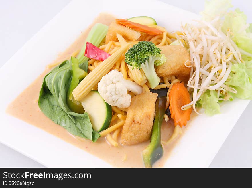 Hokkien noodles with red curry sauce and fresh vegetables