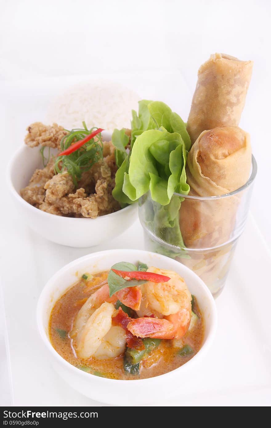 Thai food set with rice and spring roll.