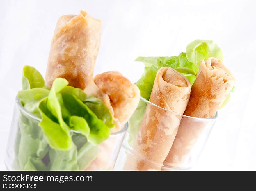 Spring roll with green leaves.  Thai appeitizer