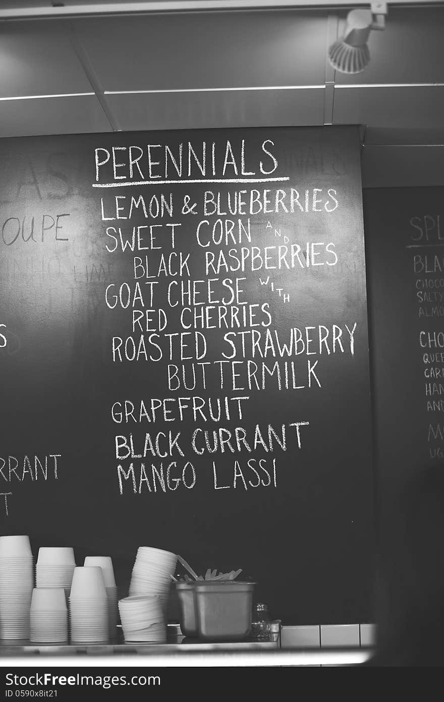 Black and white chalkboard image of the inside of an ice cream shop, handwritten in white chalk, ice cream flavors. Black and white chalkboard image of the inside of an ice cream shop, handwritten in white chalk, ice cream flavors