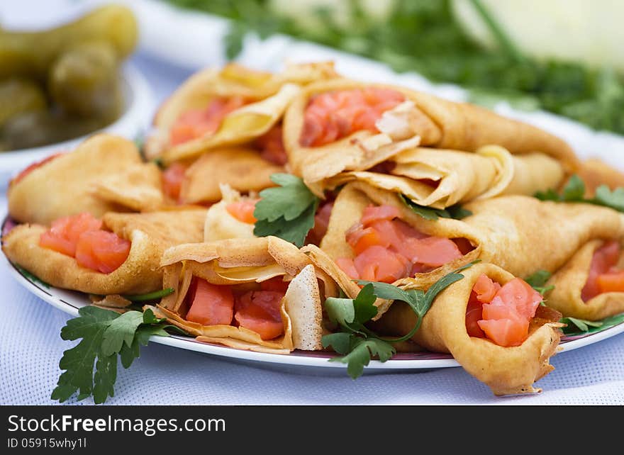 Pancakes with a salmon and parsley.