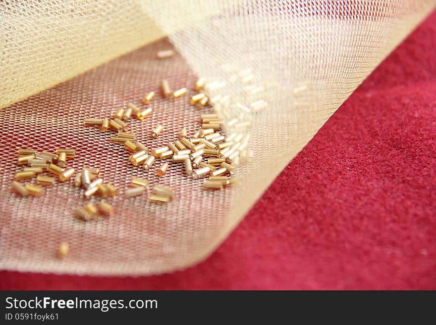 gold bead bordo on background. gold bead bordo on background