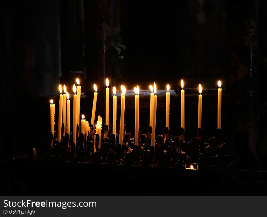 Church candles on a dark background