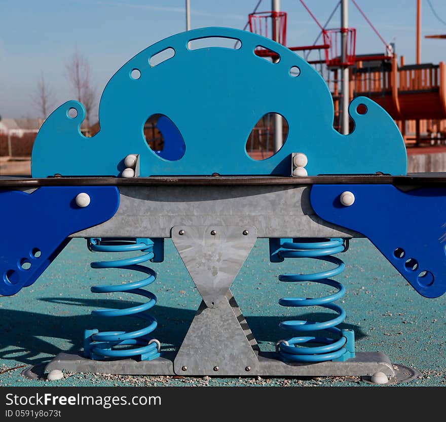 Childrens blue playground toy in the park. Childrens blue playground toy in the park.