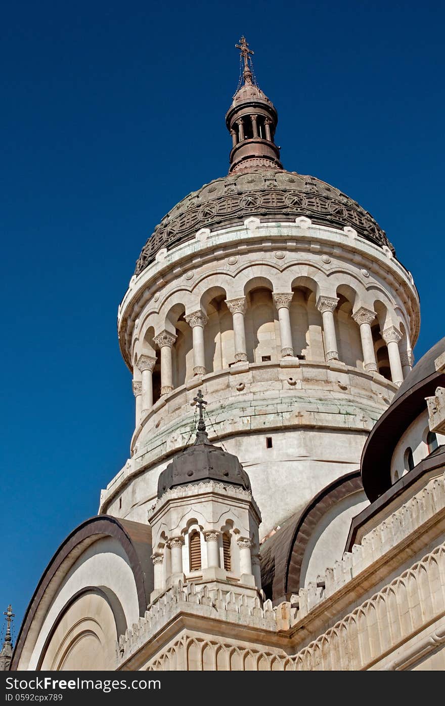 Architectural detail of the dome of the Dormition of the Theotokos Orthodox Cathedral of Cluj, Feleacu and Vadu, Romania. Shot against the blue sky with a polarizing filter. Architectural detail of the dome of the Dormition of the Theotokos Orthodox Cathedral of Cluj, Feleacu and Vadu, Romania. Shot against the blue sky with a polarizing filter.