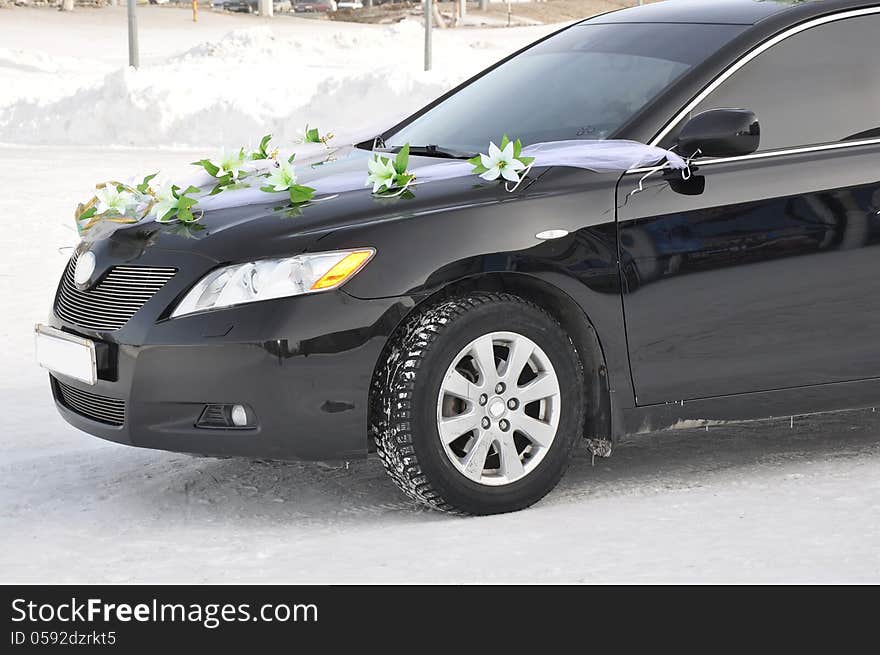 Wedding car decoration. Wedding cortege, delivers the groom and the bride to the wedding site