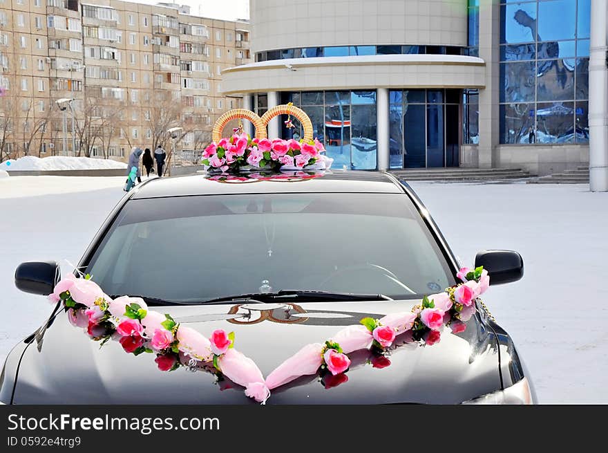 Wedding car decoration. Wedding cortege, delivers the groom and the bride to the wedding site