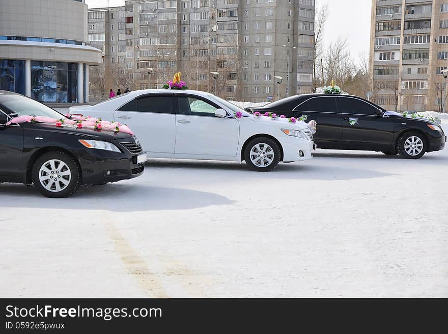 Wedding car decoration. Wedding cortege, delivers the groom and the bride to the wedding site