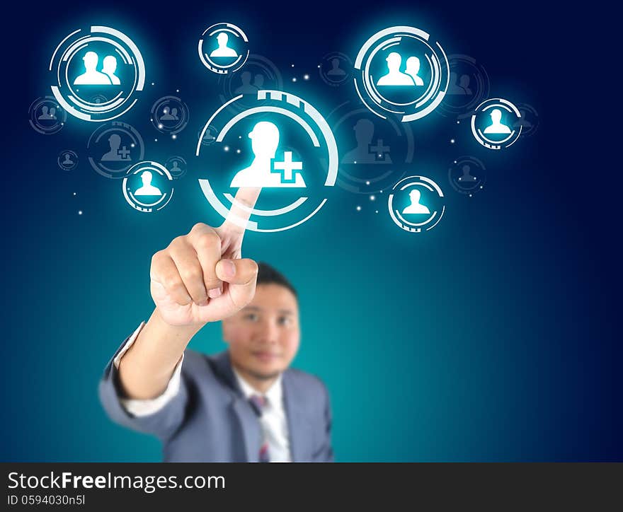 Businessman touching modern social buttons on a virtual background