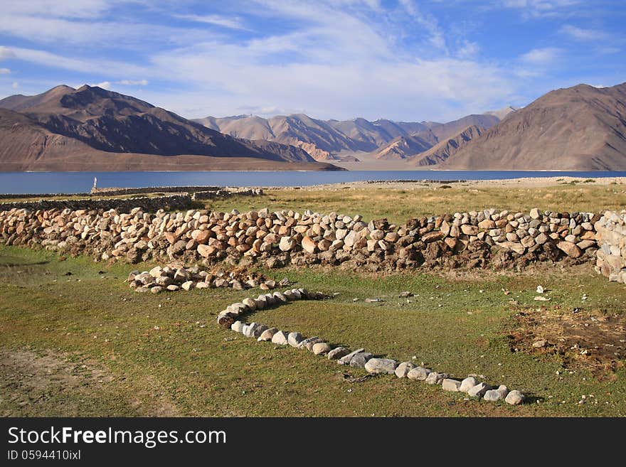 Pangong lake (Pangong Tso) is an endorheic lake in the Himalayas situated at a height of about 4,350 m (14,270 ft). It is 134 km (83 mi) long and extends from India to Tibet. Pangong lake (Pangong Tso) is an endorheic lake in the Himalayas situated at a height of about 4,350 m (14,270 ft). It is 134 km (83 mi) long and extends from India to Tibet.