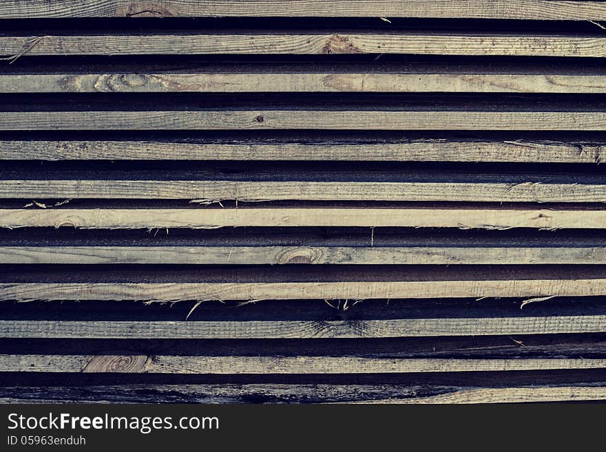 Background of their horizontally lying wooden bars. Background of their horizontally lying wooden bars