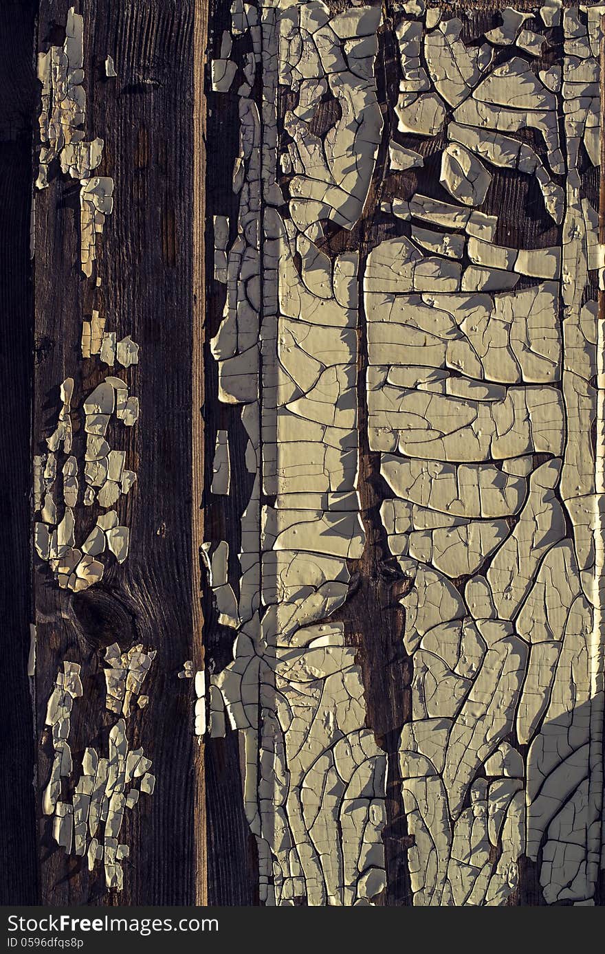 Old wooden wall with old peeled-off paint