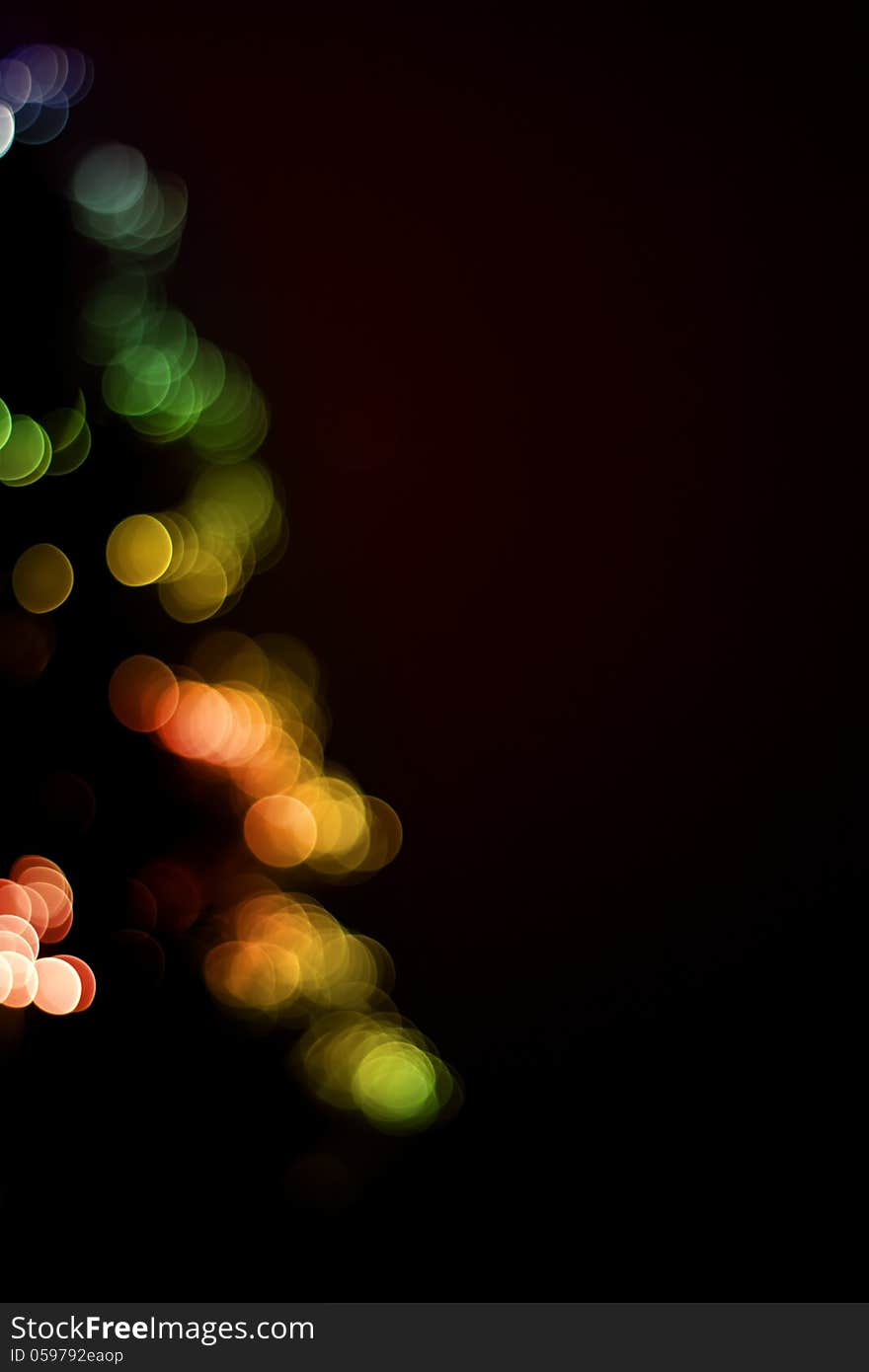 Blurred christmas tree lights isolated on black