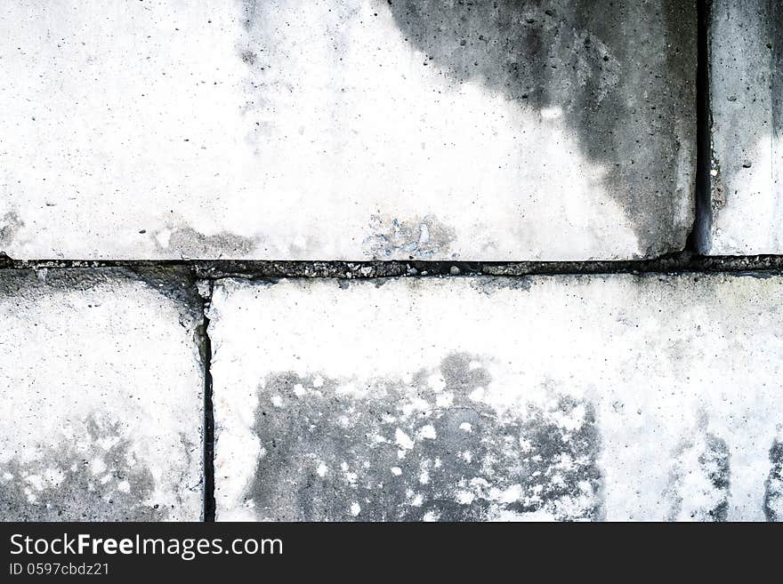 Dirty old wall from concrete blocks as a background