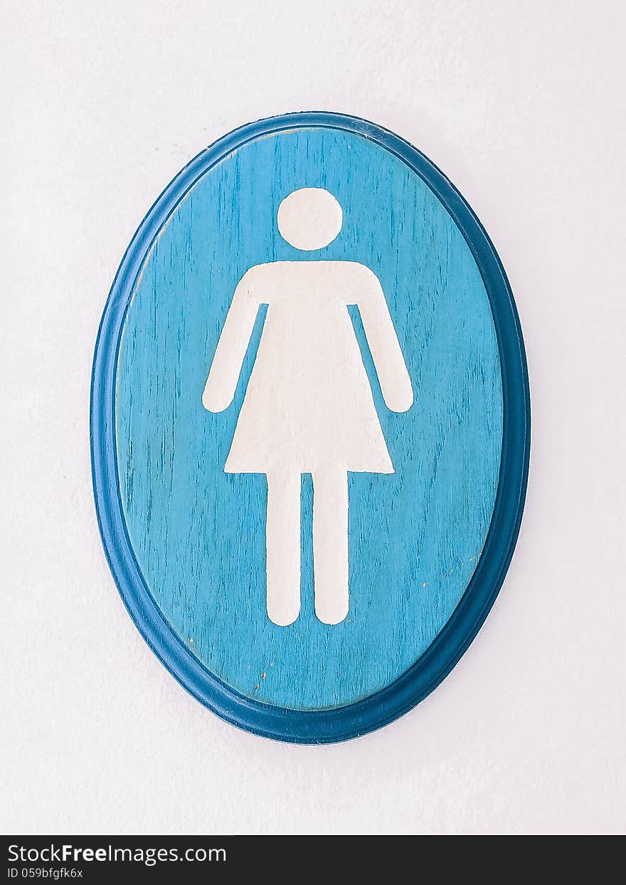 Wooden woman rest room sign