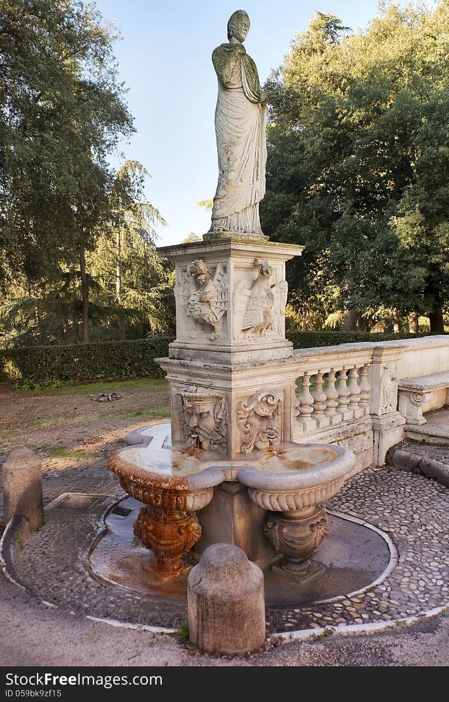 Roman fountains, ancient statue in the park of the Villa Borghese, Rome, Italy